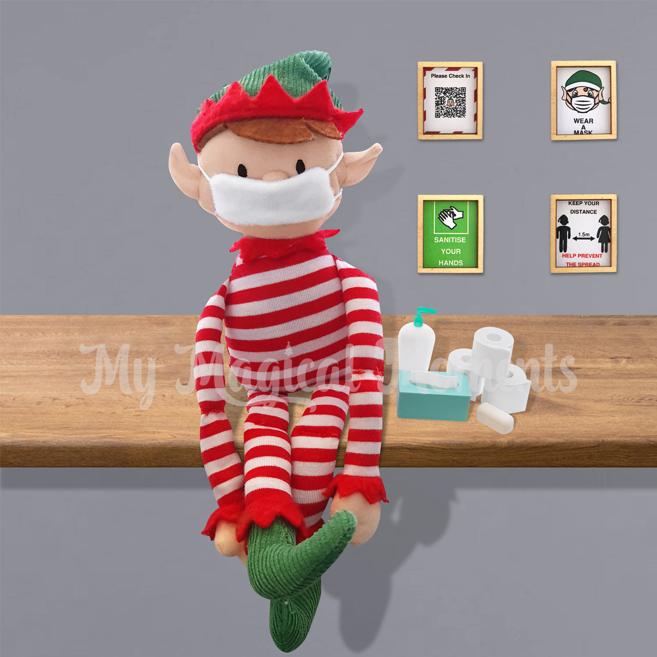An elf for Christmas sitting in isolation on a shelf wearing a mini face mask and miniature elf isolation props