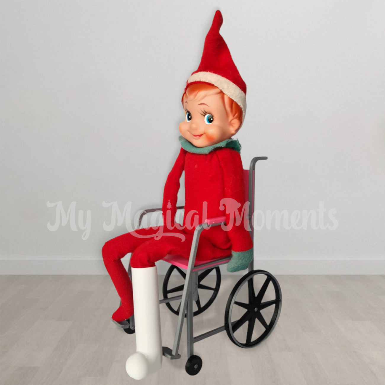 Vintage elf in a wheelchair wearing a leg cast