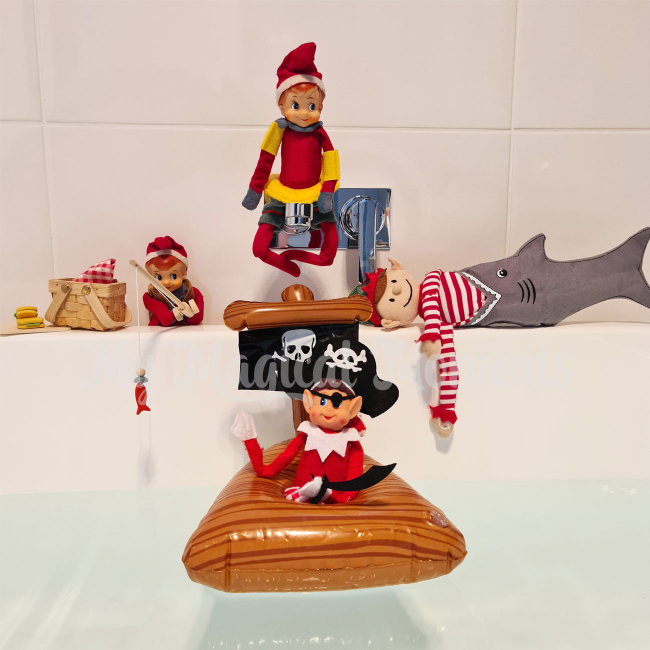 Elf scene in bath tub. Featuring elves behavin badly in a floating pirate ship. A shark eating costume and a elf fishing with a miniature rod