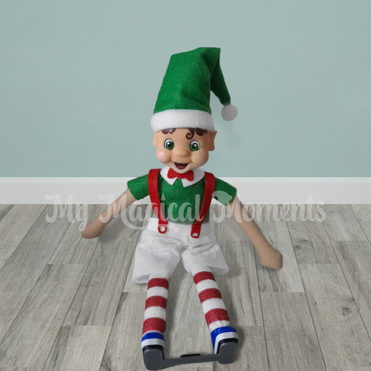 Adult elf wearing ponseti boots prop