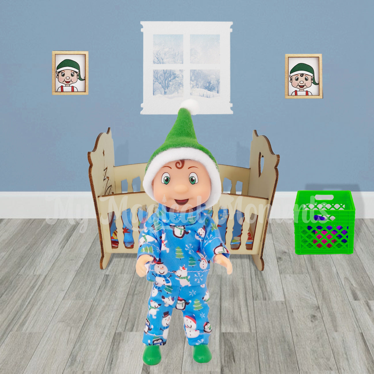 Elf toddler wearing blue snow pyjamas